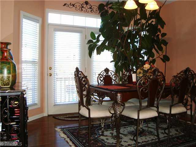 2119 Edgemont Road Greensboro, NC 27406 - Photo 12 of 16 Breakfast. The hardwoods extend to the breakfast area where a patio door opens to the rear deck.