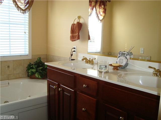 2119 Edgemont Road Greensboro, NC 27406 - Photo 14 of 16 Master Bath/Spa. The master bath features a double vanity, jetted tub and walk-in shower.