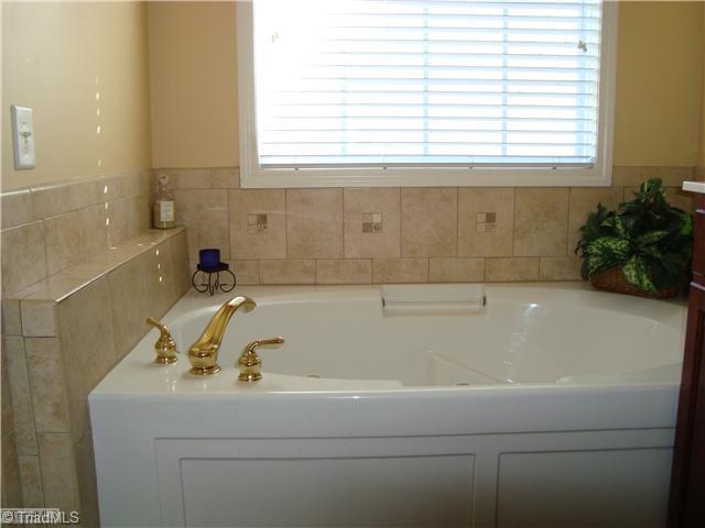 2119 Edgemont Road Greensboro, NC 27406 - Photo 15 of 16 Master Bath/Spa. Nice tile work surrounds the jetted tub.