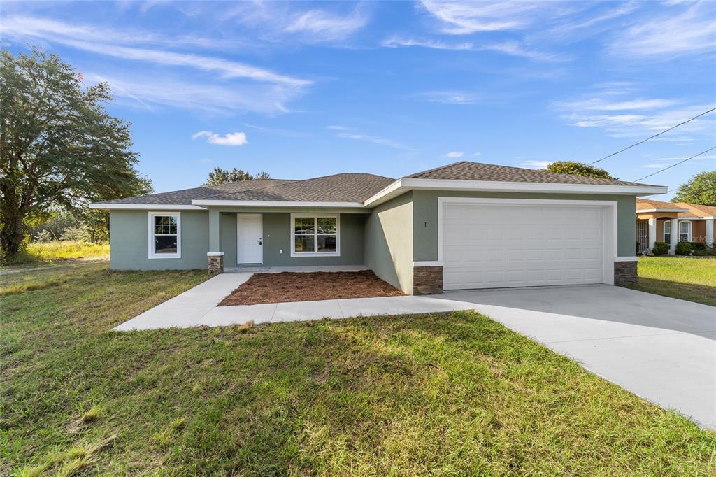 23 Oak Pass Loop Ocala, FL 34472 - Photo 1 of 1 front view of a house with a yard