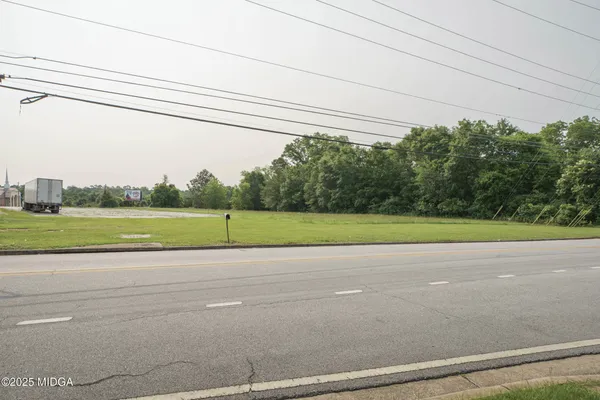 a view of a road and a yard