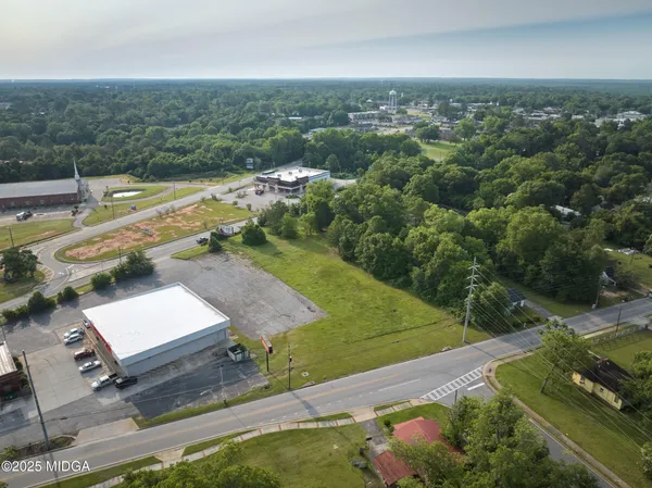 a view of a field with an ocean