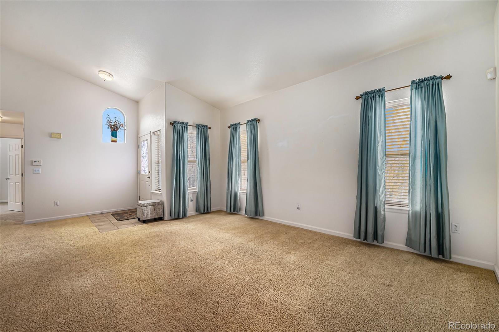 5800 Tower Road, Unit 505 Denver, CO 80249 - Photo 13 of 24 an empty room with closet and windows