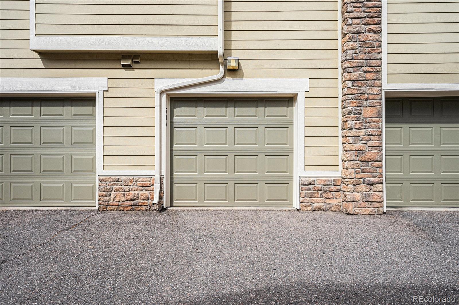 5800 Tower Road, Unit 505 Denver, CO 80249 - Photo 20 of 24 a front view of a house with a garage