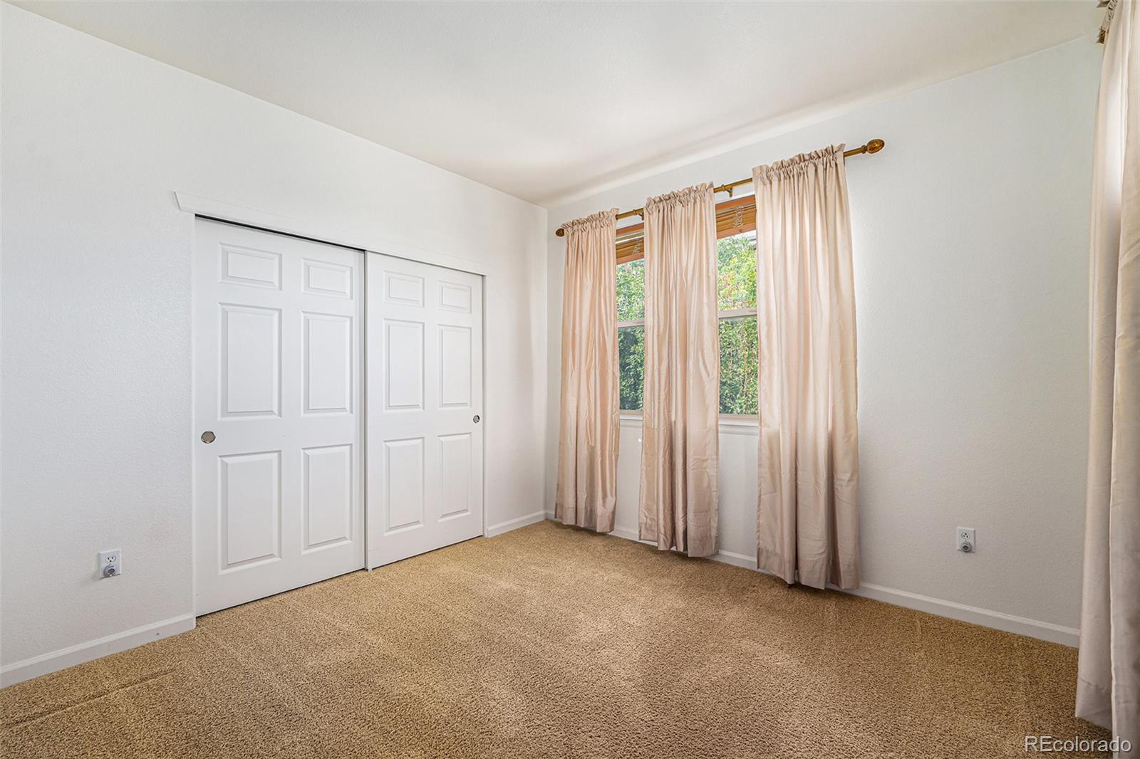 5800 Tower Road, Unit 505 Denver, CO 80249 - Photo 23 of 24 a view of an empty room with a window