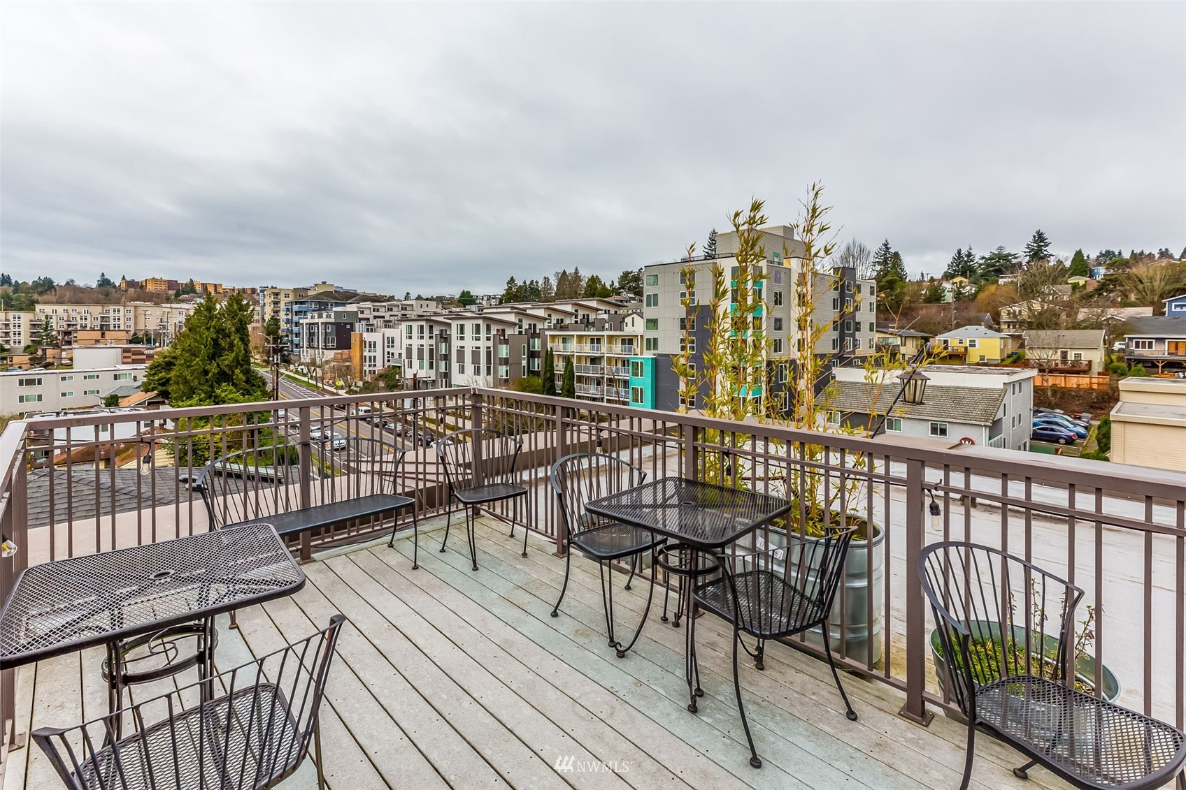 3015 Southwest Avalon Way, Unit 106 Seattle, WA 98126 - Photo 18 of 20 a view of a balcony with wooden chairs