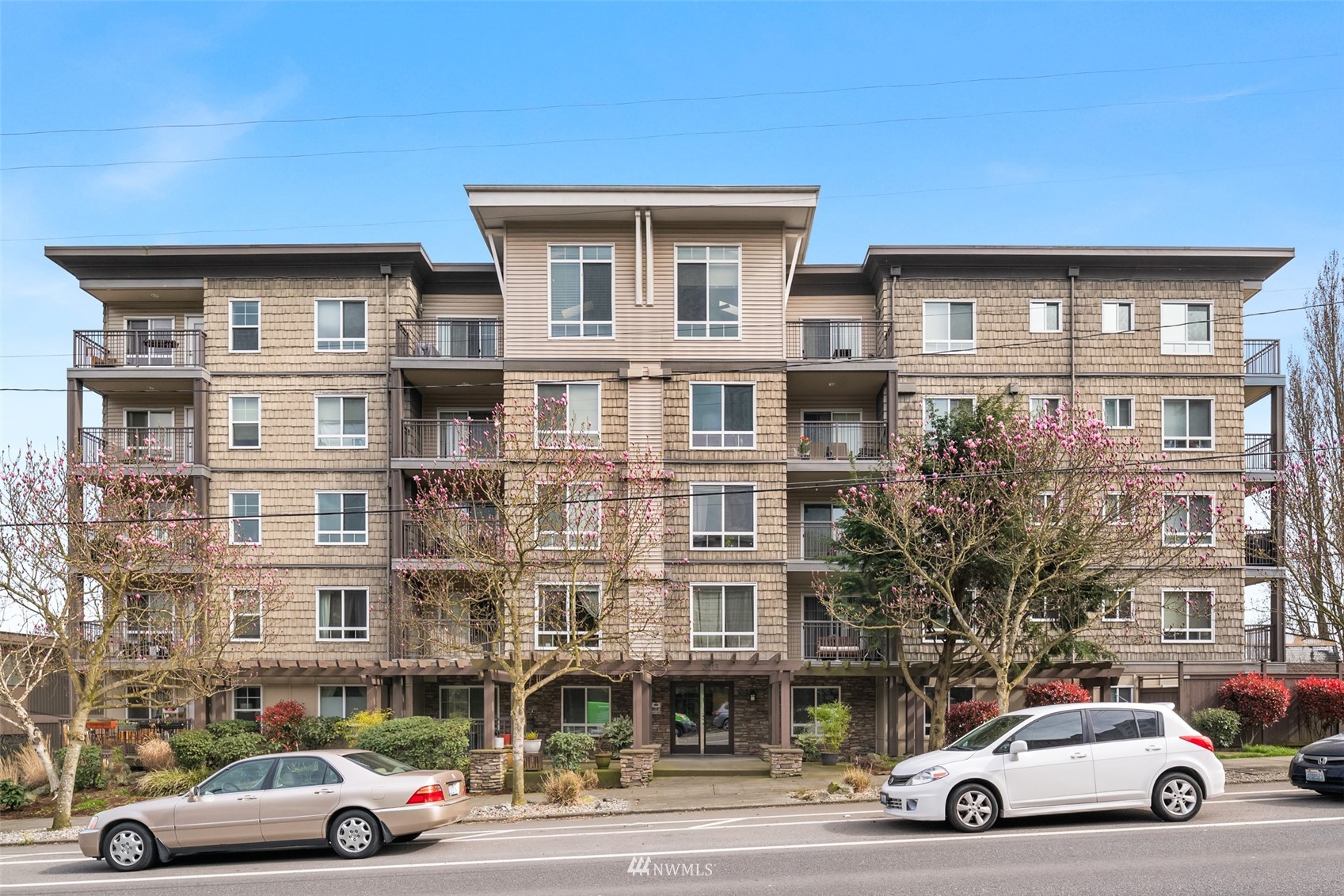 3015 Southwest Avalon Way, Unit 106 Seattle, WA 98126 - Photo 20 of 20 a car parked in front of a building