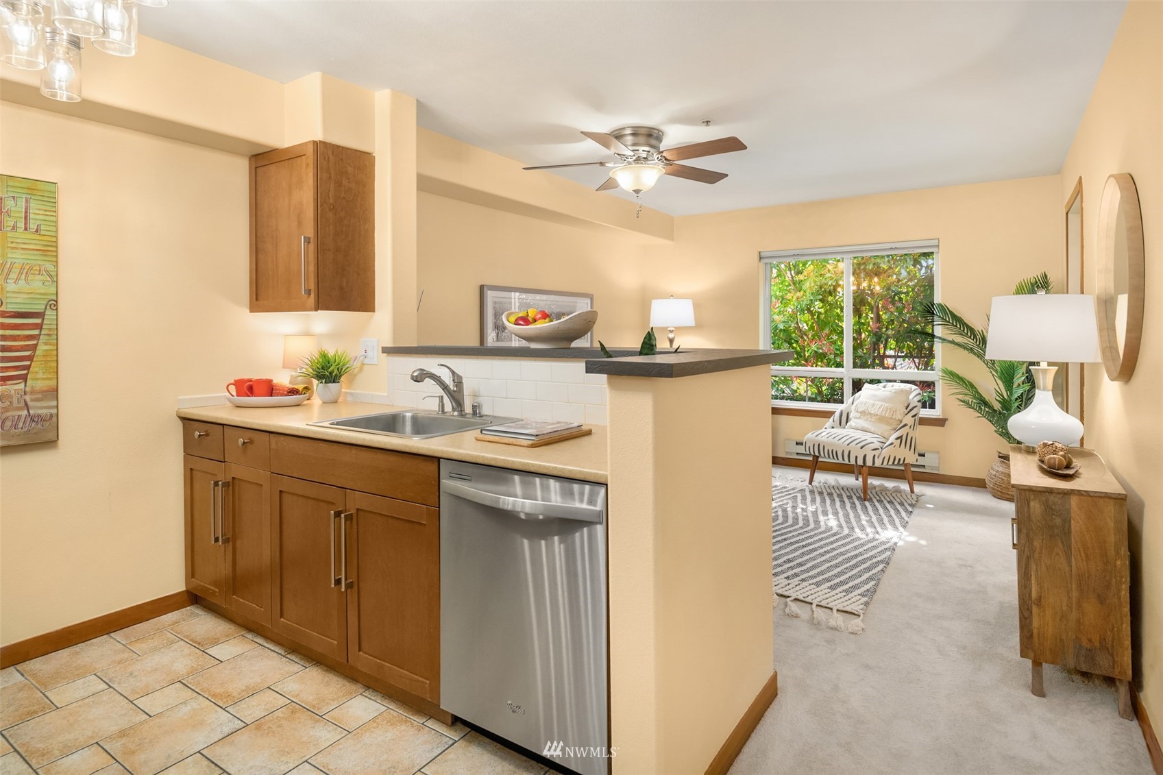 3015 Southwest Avalon Way, Unit 106 Seattle, WA 98126 - Photo 5 of 20 a kitchen with a sink appliances and cabinets