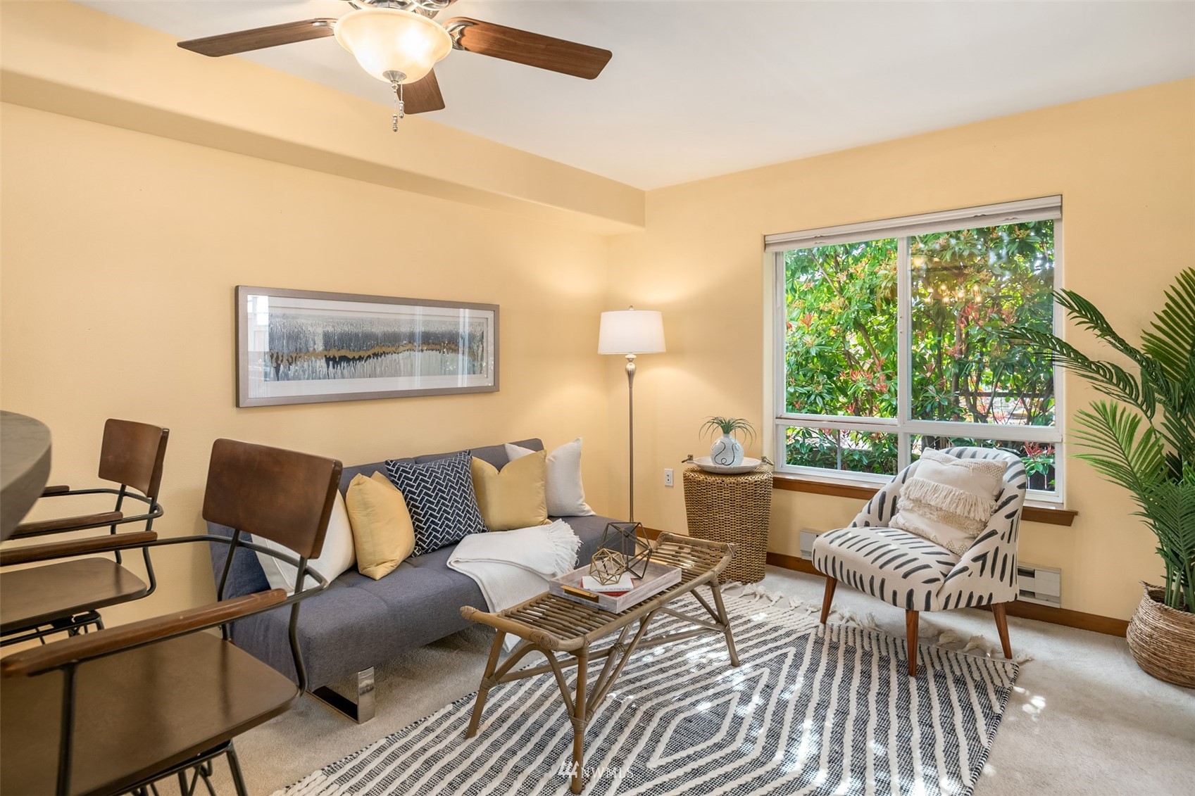 3015 Southwest Avalon Way, Unit 106 Seattle, WA 98126 - Photo 6 of 20 a living room with furniture and a window