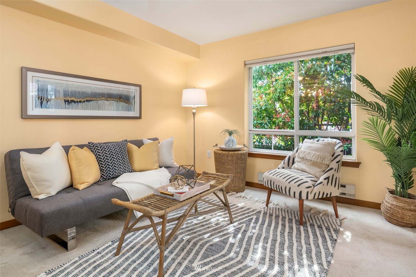 3015 Southwest Avalon Way, Unit 106 Seattle, WA 98126 - Photo 7 of 20 a living room with furniture and a large window