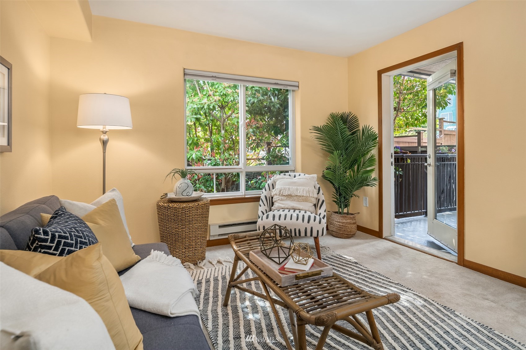 3015 Southwest Avalon Way, Unit 106 Seattle, WA 98126 - Photo 8 of 20 a living room with furniture and a window