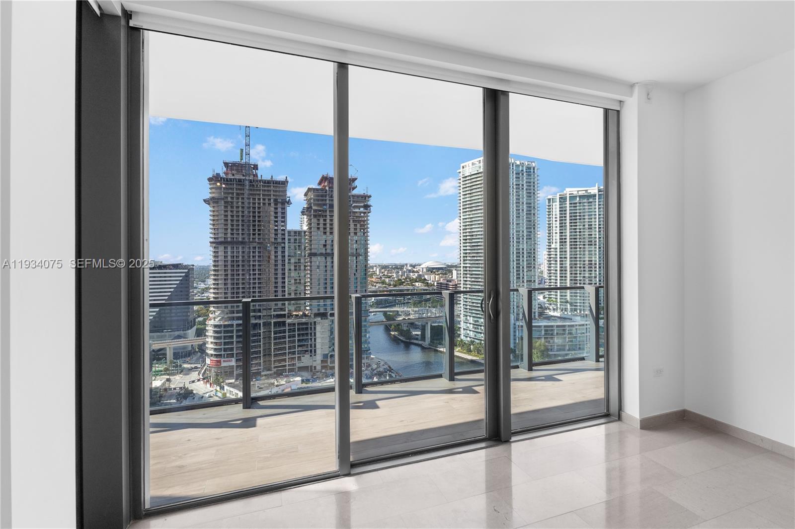 68 Southeast 6th Street, Unit 2006 Miami, FL 33131 - Photo 12 of 49 a view of a living room and window