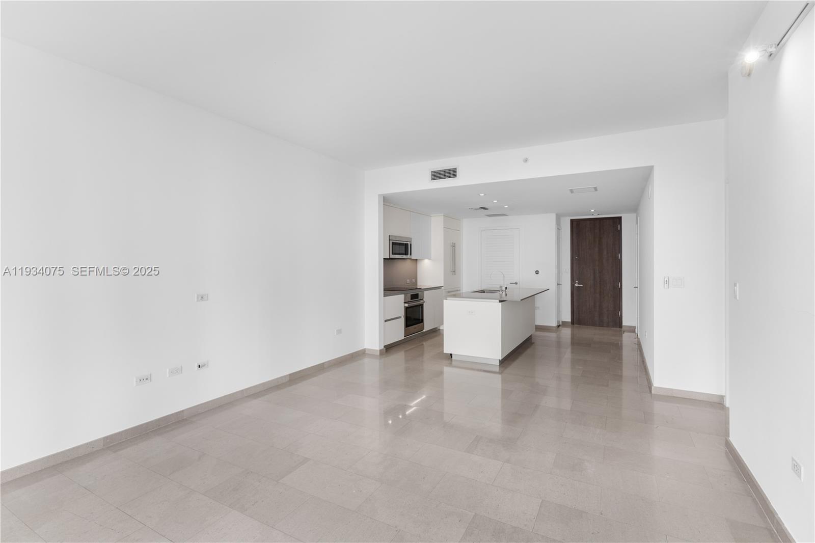 68 Southeast 6th Street, Unit 2006 Miami, FL 33131 - Photo 13 of 49 a view of empty room with white walls and white walls