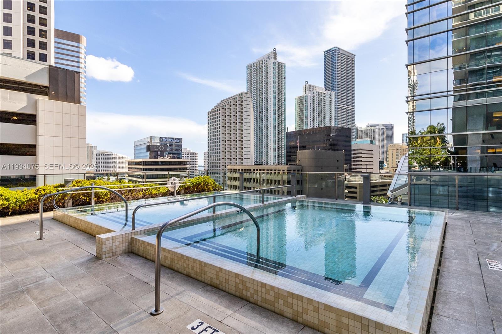 68 Southeast 6th Street, Unit 2006 Miami, FL 33131 - Photo 34 of 49 a view of swimming pool with outdoor seating