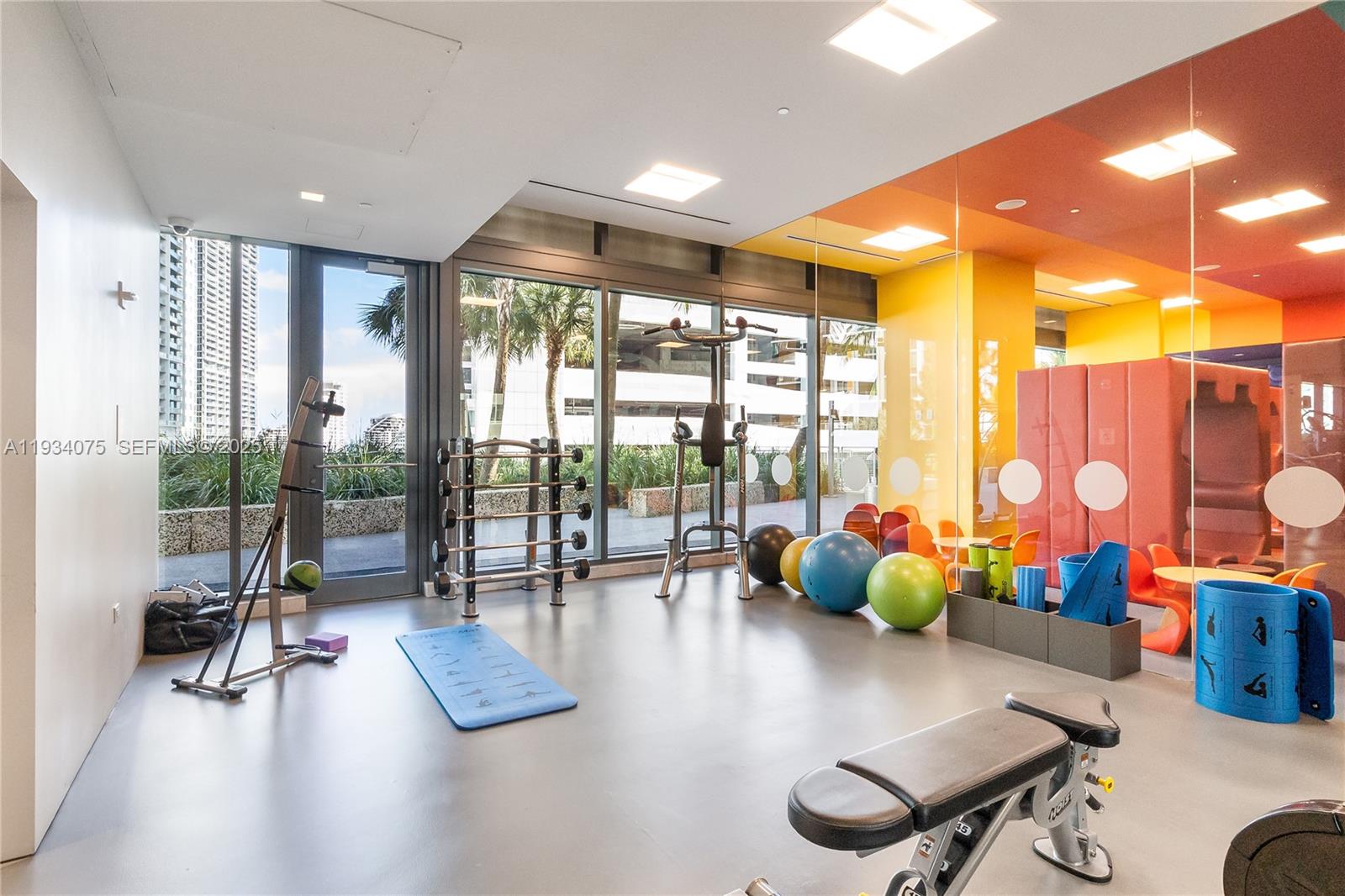 68 Southeast 6th Street, Unit 2006 Miami, FL 33131 - Photo 36 of 49 a living room with furniture and floor to ceiling window