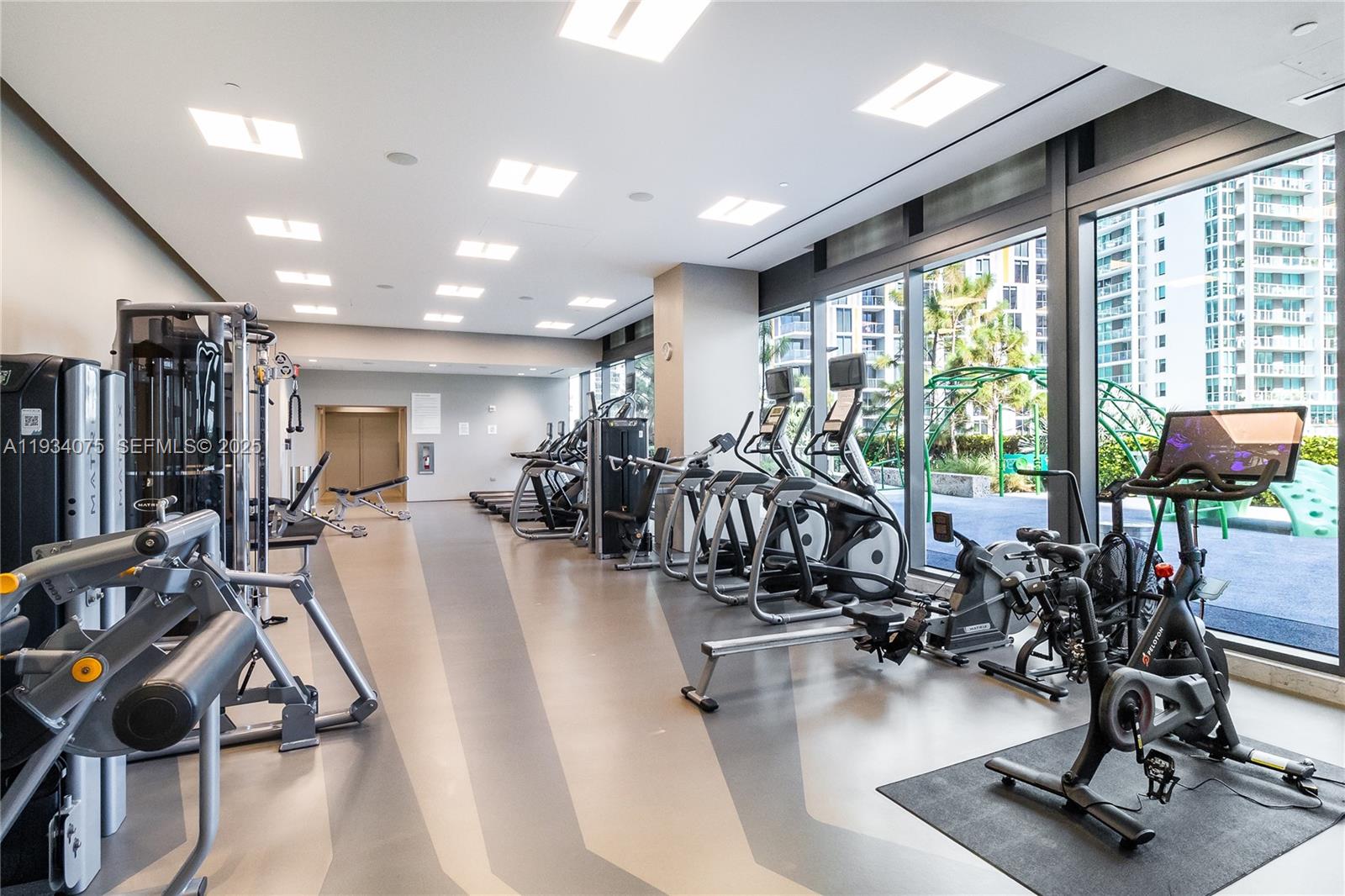 68 Southeast 6th Street, Unit 2006 Miami, FL 33131 - Photo 37 of 49 a view of a room with gym equipment