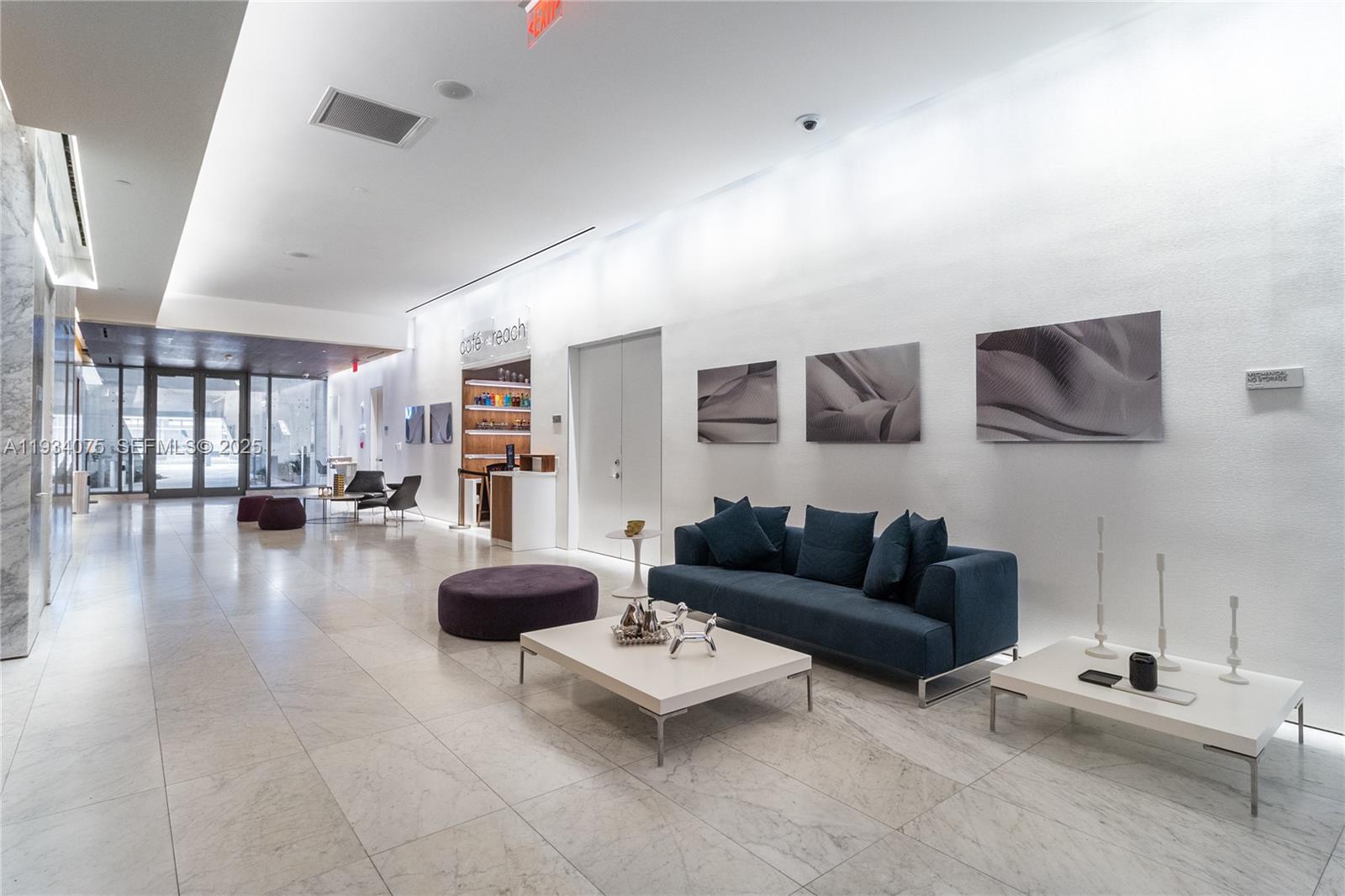 68 Southeast 6th Street, Unit 2006 Miami, FL 33131 - Photo 40 of 49 a living room with furniture and a wooden floor