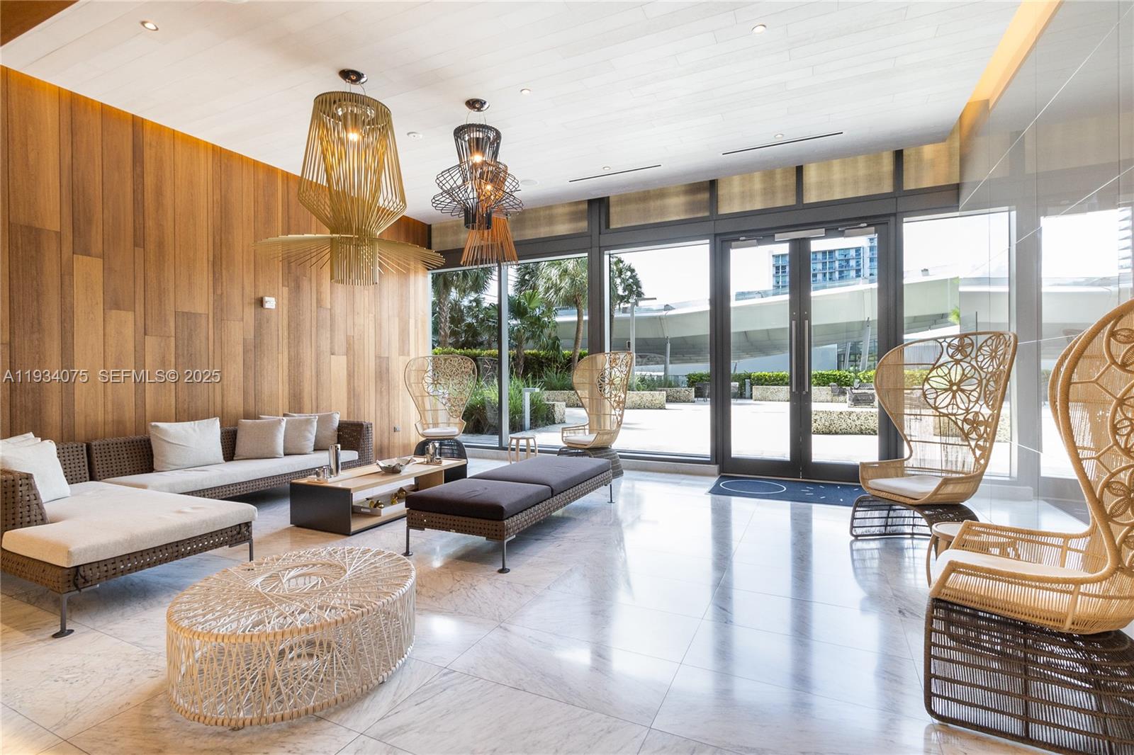 68 Southeast 6th Street, Unit 2006 Miami, FL 33131 - Photo 41 of 49 a living room with furniture and a large window