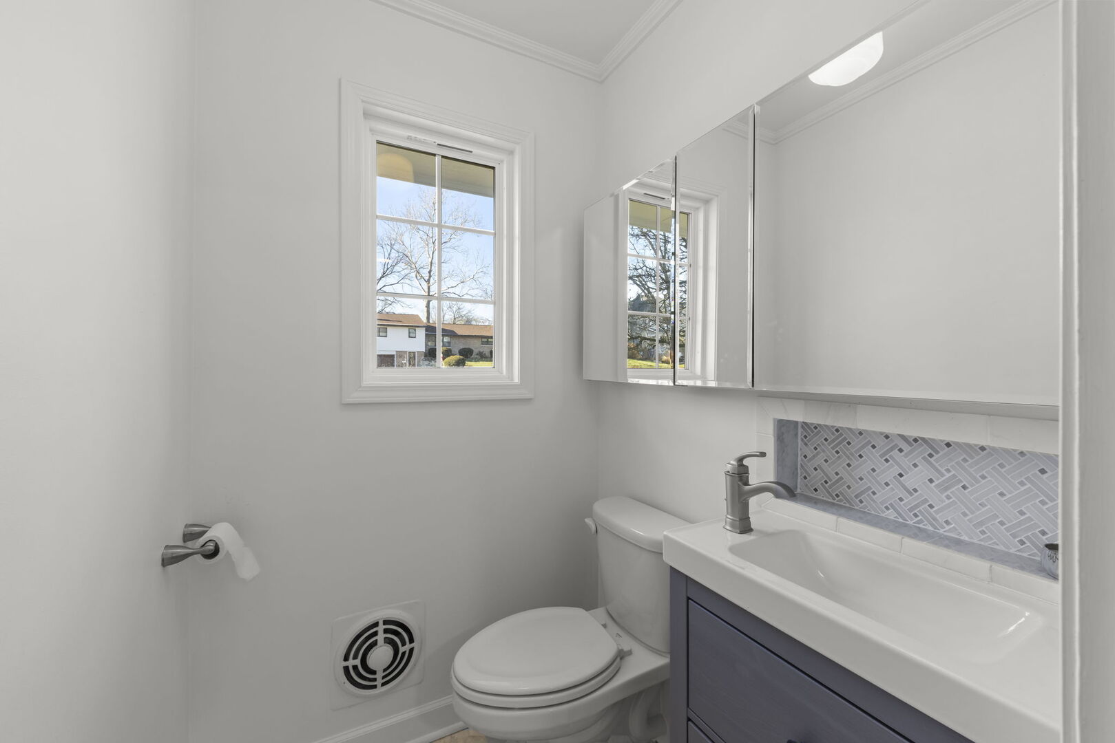 291 Spring Avenue Glen Ellyn, IL 60137 - Photo 14 of 35 a bathroom with a sink toilet and window
