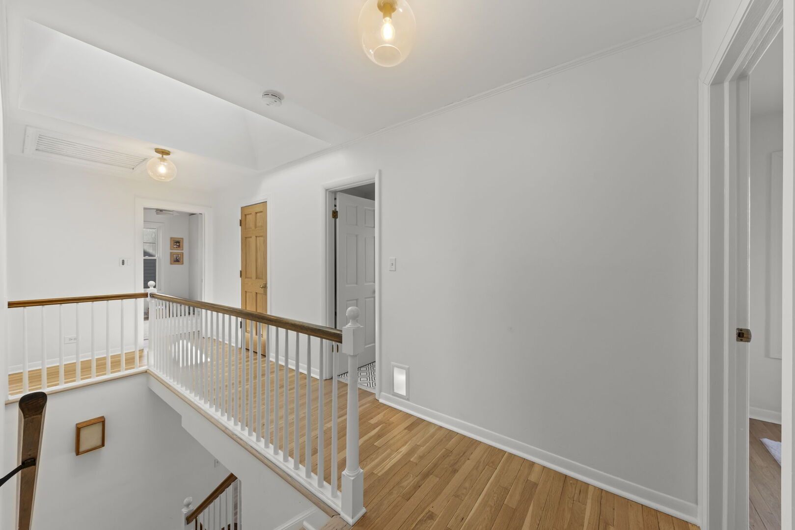 291 Spring Avenue Glen Ellyn, IL 60137 - Photo 15 of 35 a view of an empty room with wooden floor