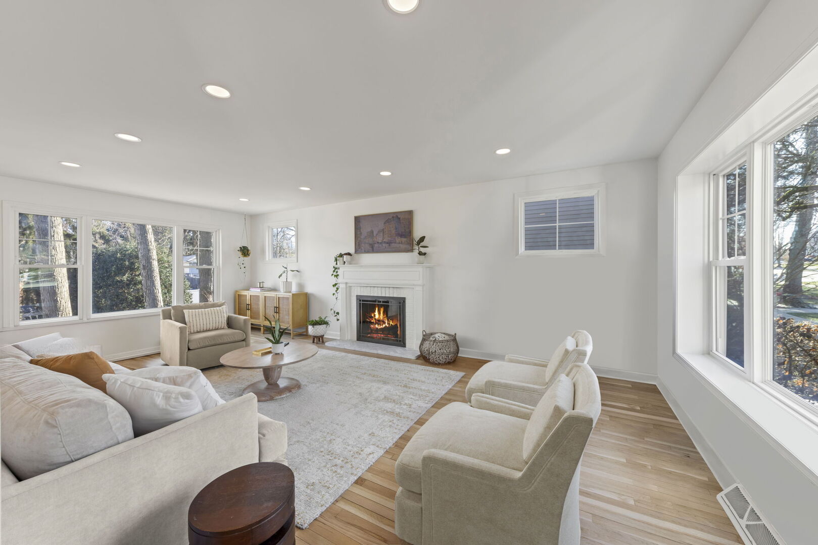 291 Spring Avenue Glen Ellyn, IL 60137 - Photo 5 of 35 a living room with furniture a fireplace and a large window