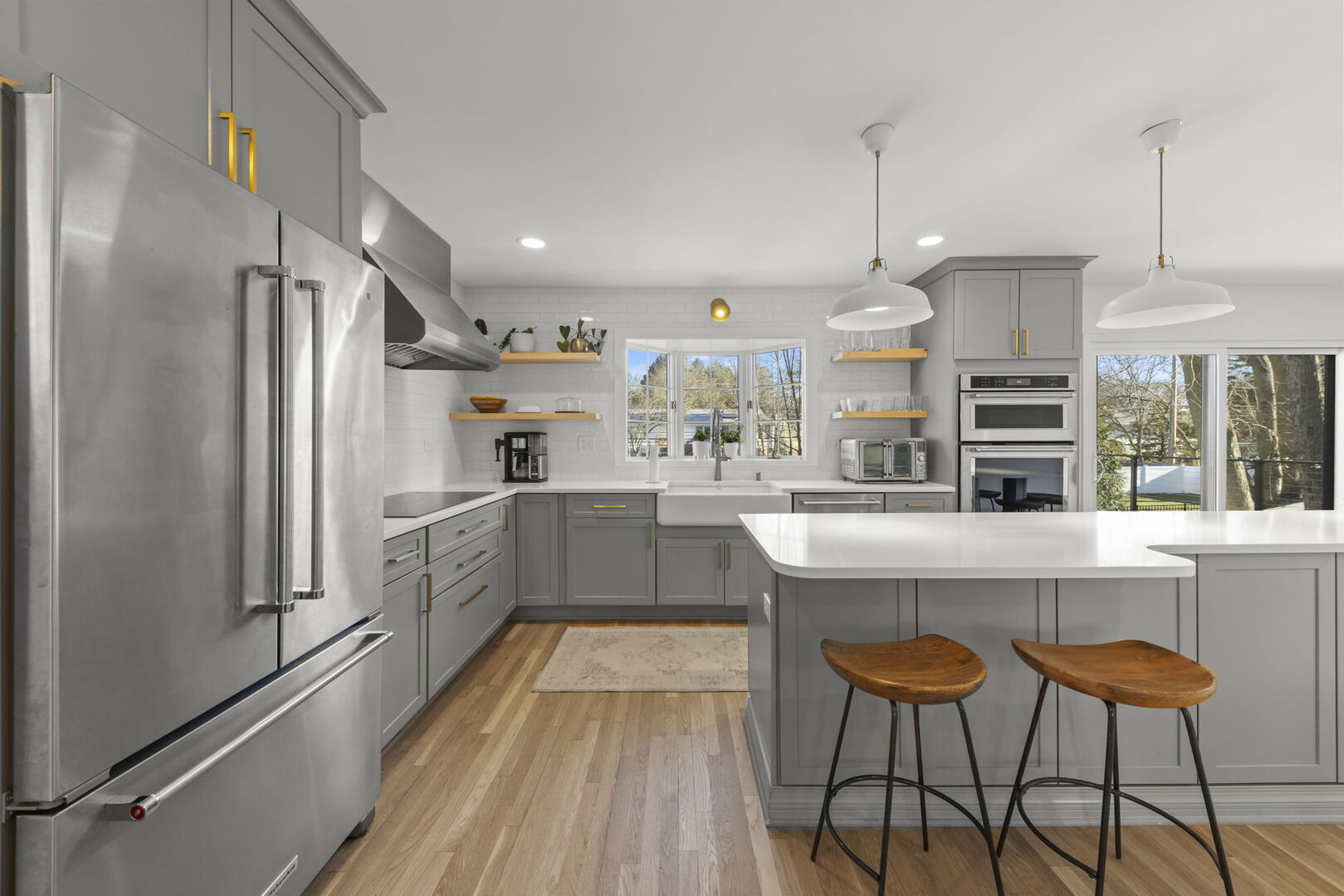 291 Spring Avenue Glen Ellyn, IL 60137 - Photo 9 of 35 a kitchen with stainless steel appliances granite countertop a refrigerator a sink dishwasher a stove and white cabinets with wooden floor