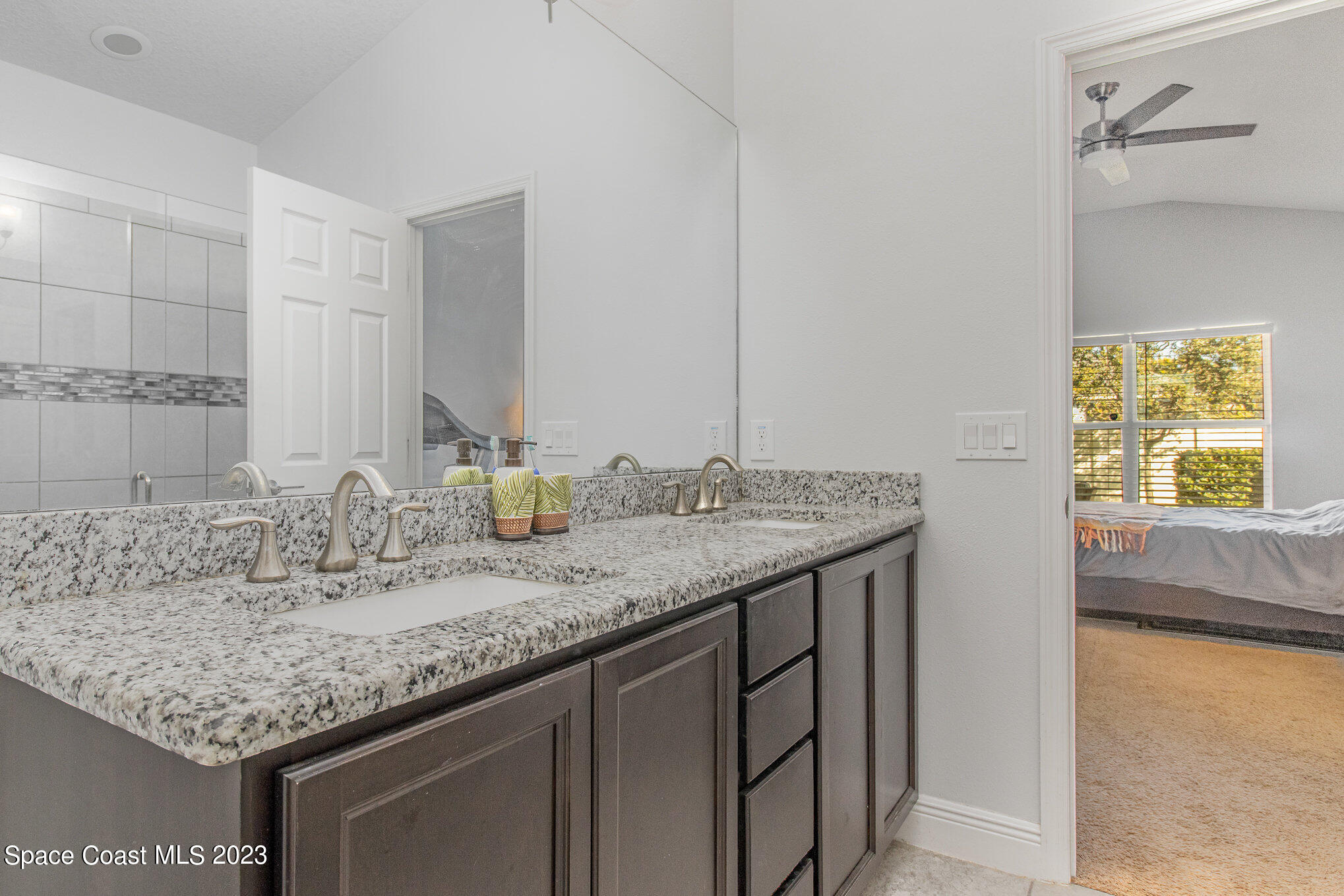 4362 Ruthann Circle Melbourne, FL 32934 - Photo 13 of 25 PRIMARY BATHROOM WITH DOUBLE SINKS