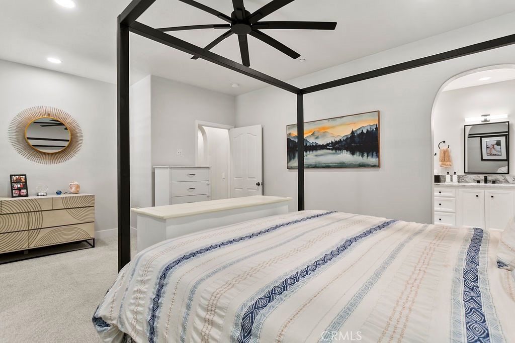 37 Walbert Lane Ladera Ranch, CA 92694 - Photo 13 of 27 a bedroom with a bed and a chandelier