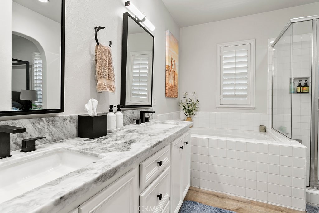 37 Walbert Lane Ladera Ranch, CA 92694 - Photo 15 of 27 a bathroom with a granite countertop sink mirror and a bathtub
