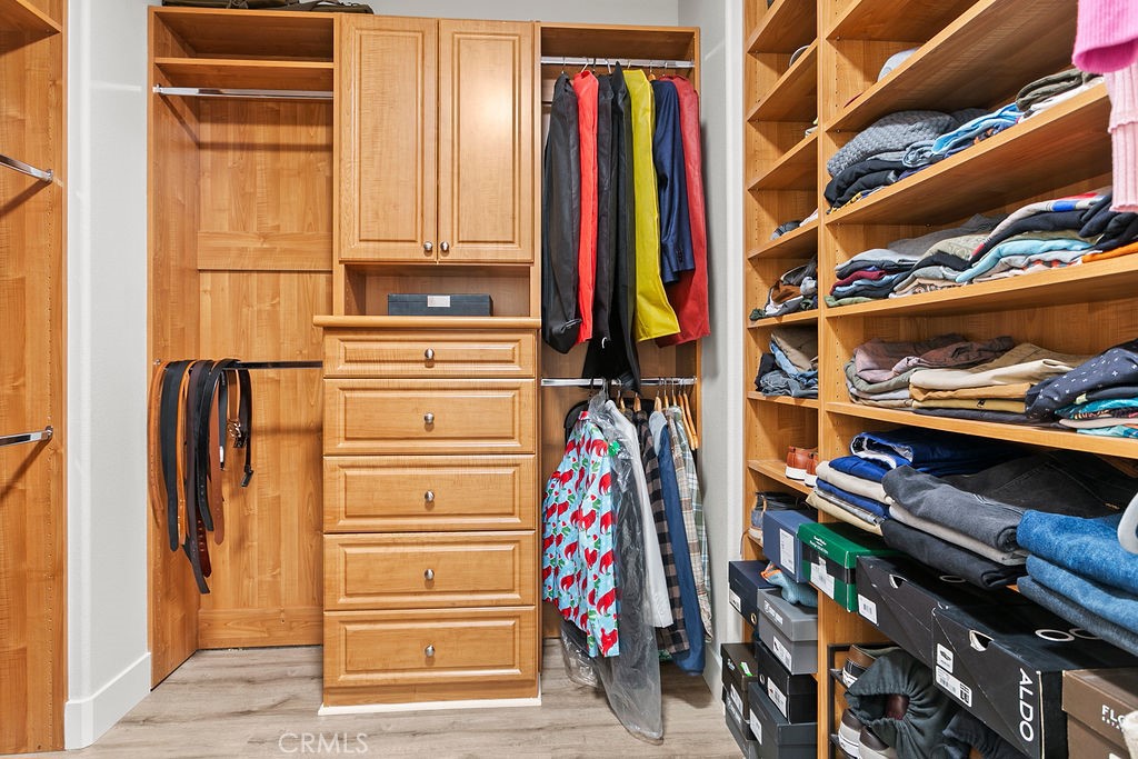 37 Walbert Lane Ladera Ranch, CA 92694 - Photo 16 of 27 a view of walk in closet with clothes and shoes