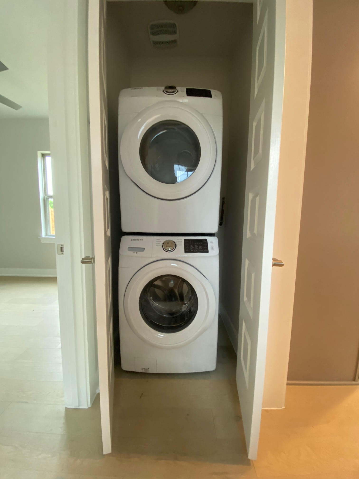 6920 Bethune Avenue, Unit 3 Austin, TX 78752 - Photo 11 of 26 Laundry room featuring stacked washer / drying machine