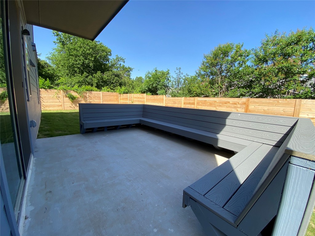 6920 Bethune Avenue, Unit 3 Austin, TX 78752 - Photo 17 of 32 Fenced backyard with a patio area