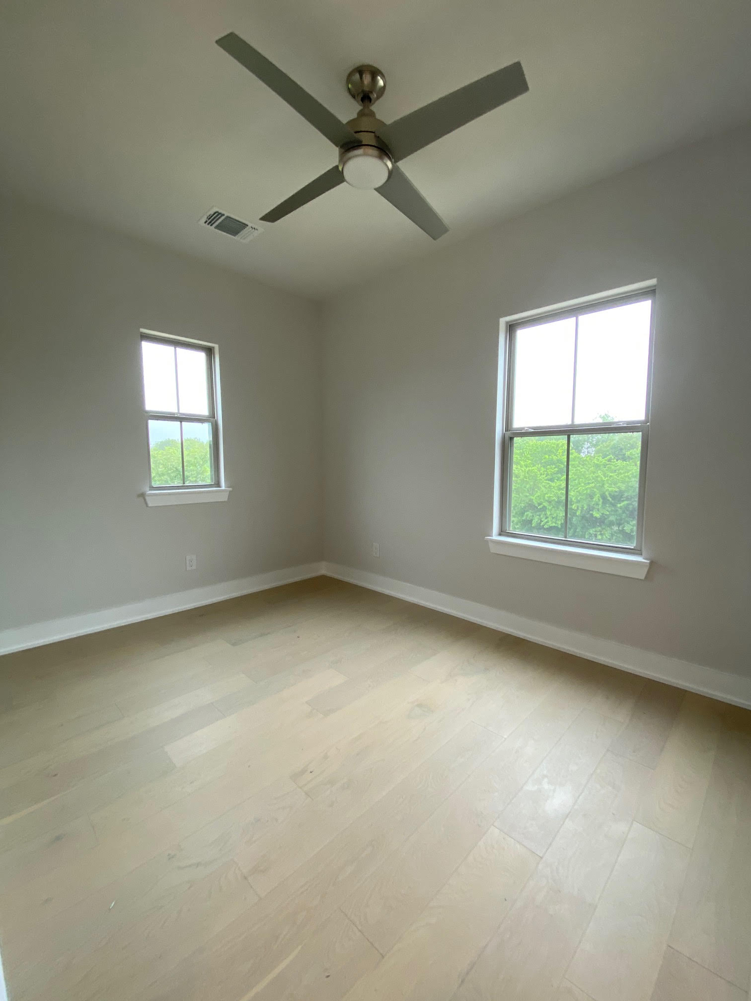 6920 Bethune Avenue, Unit 3 Austin, TX 78752 - Photo 18 of 26 Spare room featuring light wood-type flooring and ceiling fan
