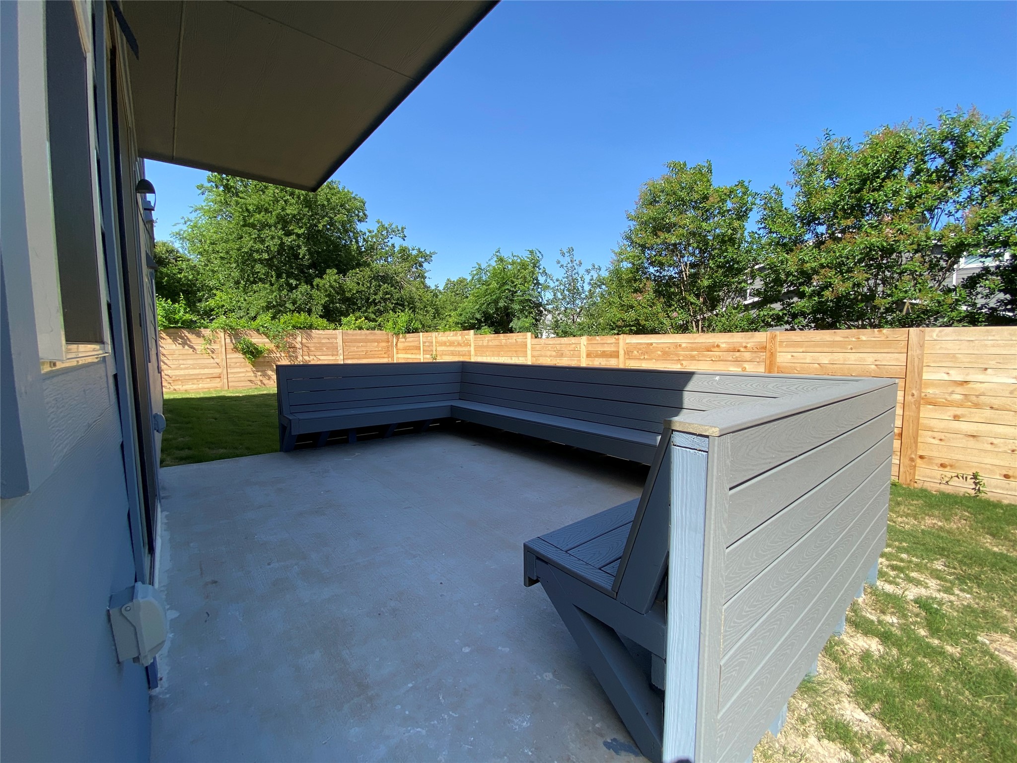 6920 Bethune Avenue, Unit 3 Austin, TX 78752 - Photo 19 of 26 Fenced backyard with a patio