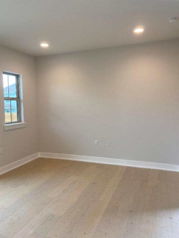 6920 Bethune Avenue, Unit 3 Austin, TX 78752 - Photo 2 of 32 Spare room with light wood-style floors and recessed lighting