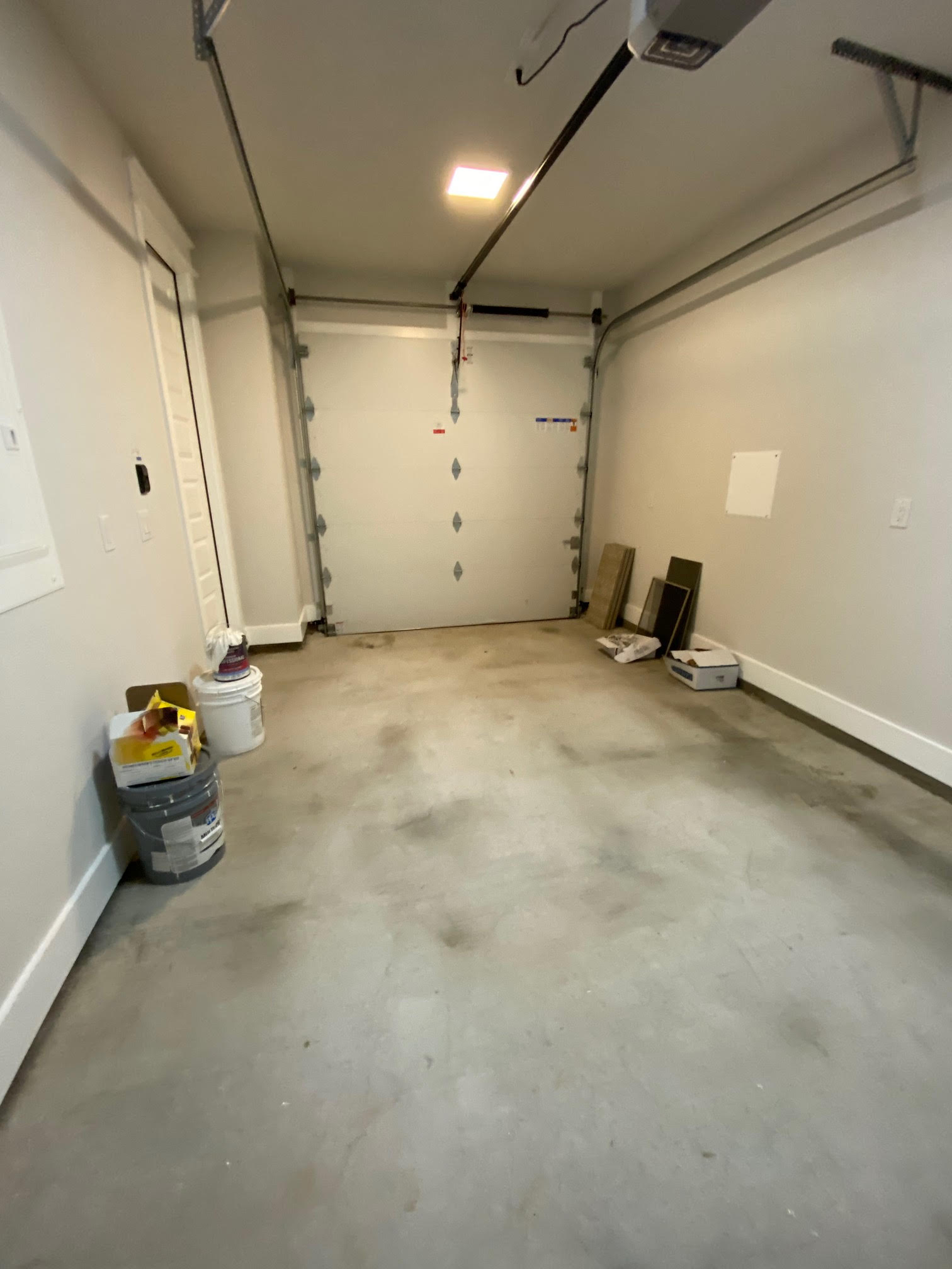 6920 Bethune Avenue, Unit 3 Austin, TX 78752 - Photo 21 of 32 Garage with a garage door opener and baseboards