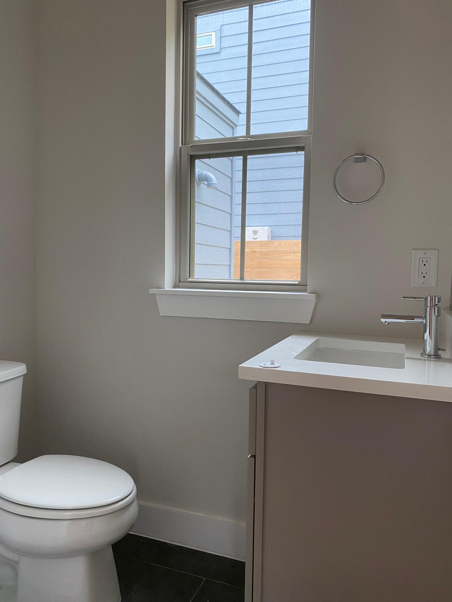 6920 Bethune Avenue, Unit 3 Austin, TX 78752 - Photo 23 of 32 Bathroom with vanity, dark tile patterned flooring, and plenty of natural light