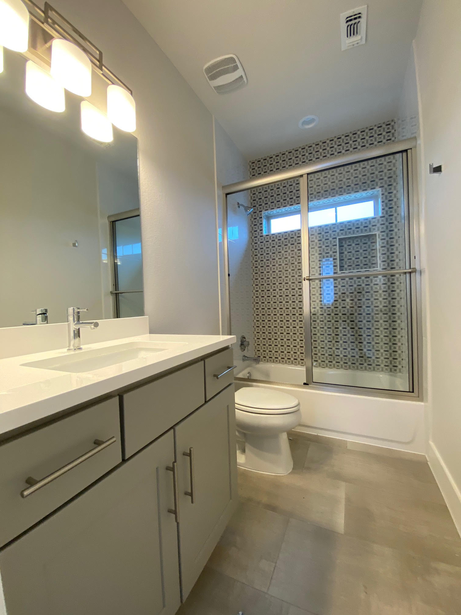 6920 Bethune Avenue, Unit 3 Austin, TX 78752 - Photo 30 of 32 Bathroom with vanity and bath / shower combo with glass door