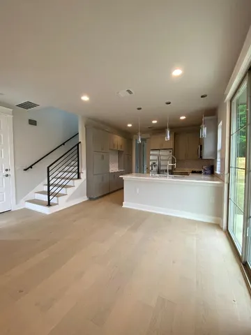 a view of a kitchen with a sink and cabinets