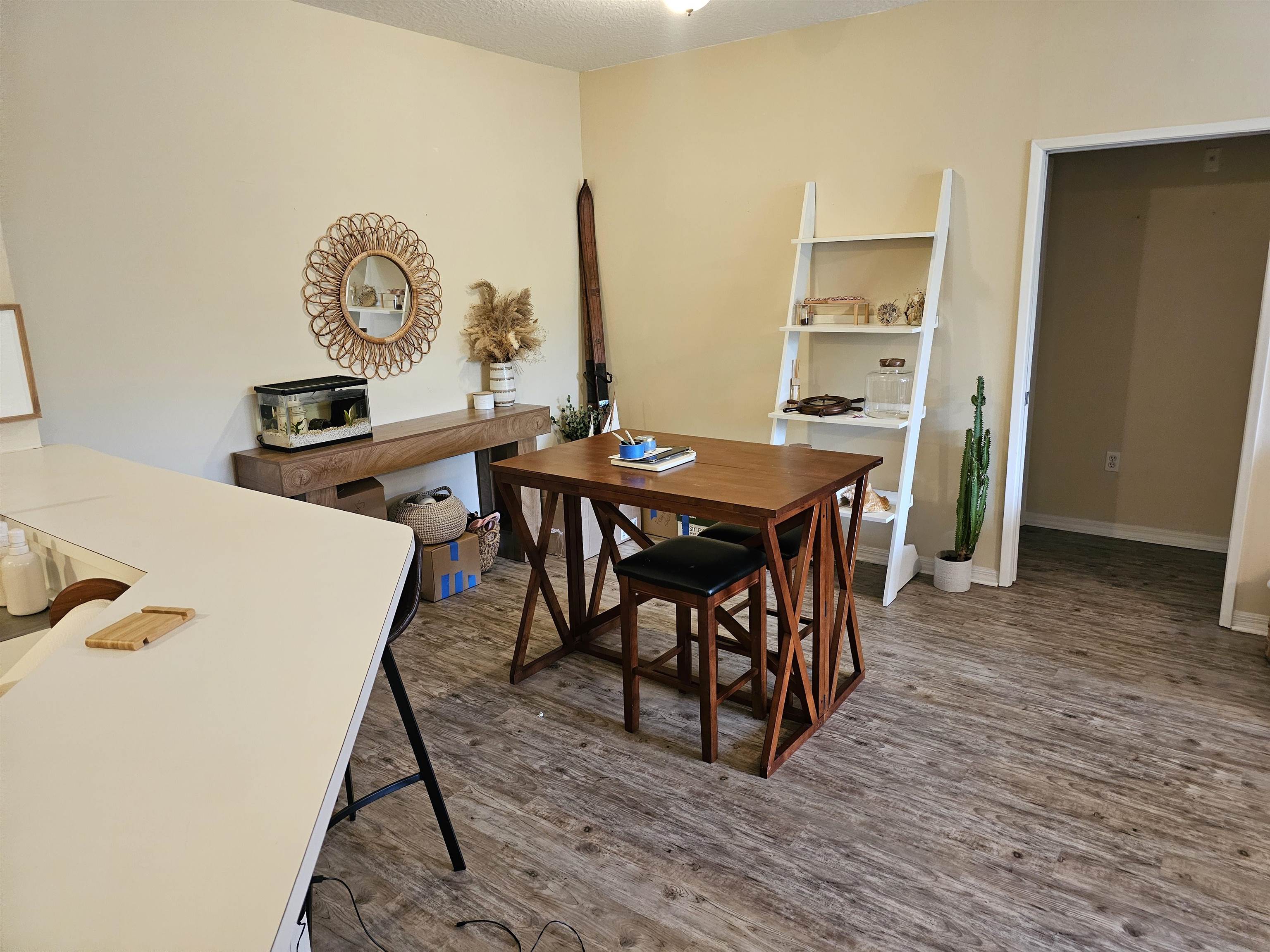 605 Fairway Drive, Unit 307 St. Augustine, FL 32084 - Photo 2 of 16 a view of a dining room with furniture and wooden floor