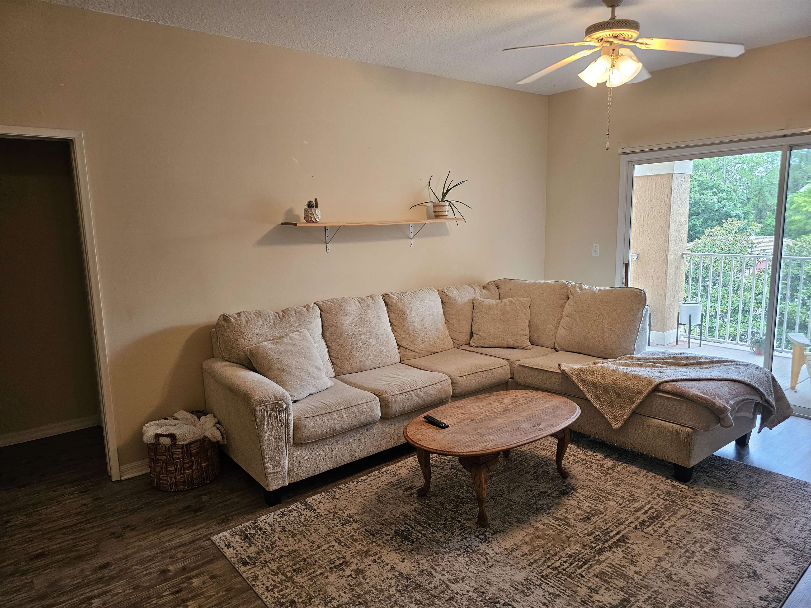 605 Fairway Drive, Unit 307 St. Augustine, FL 32084 - Photo 4 of 16 a living room with a couch and a chandelier