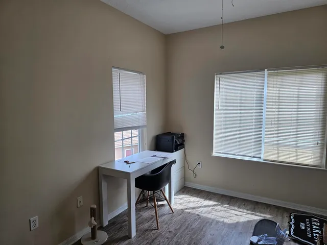 a workspace with furniture and window