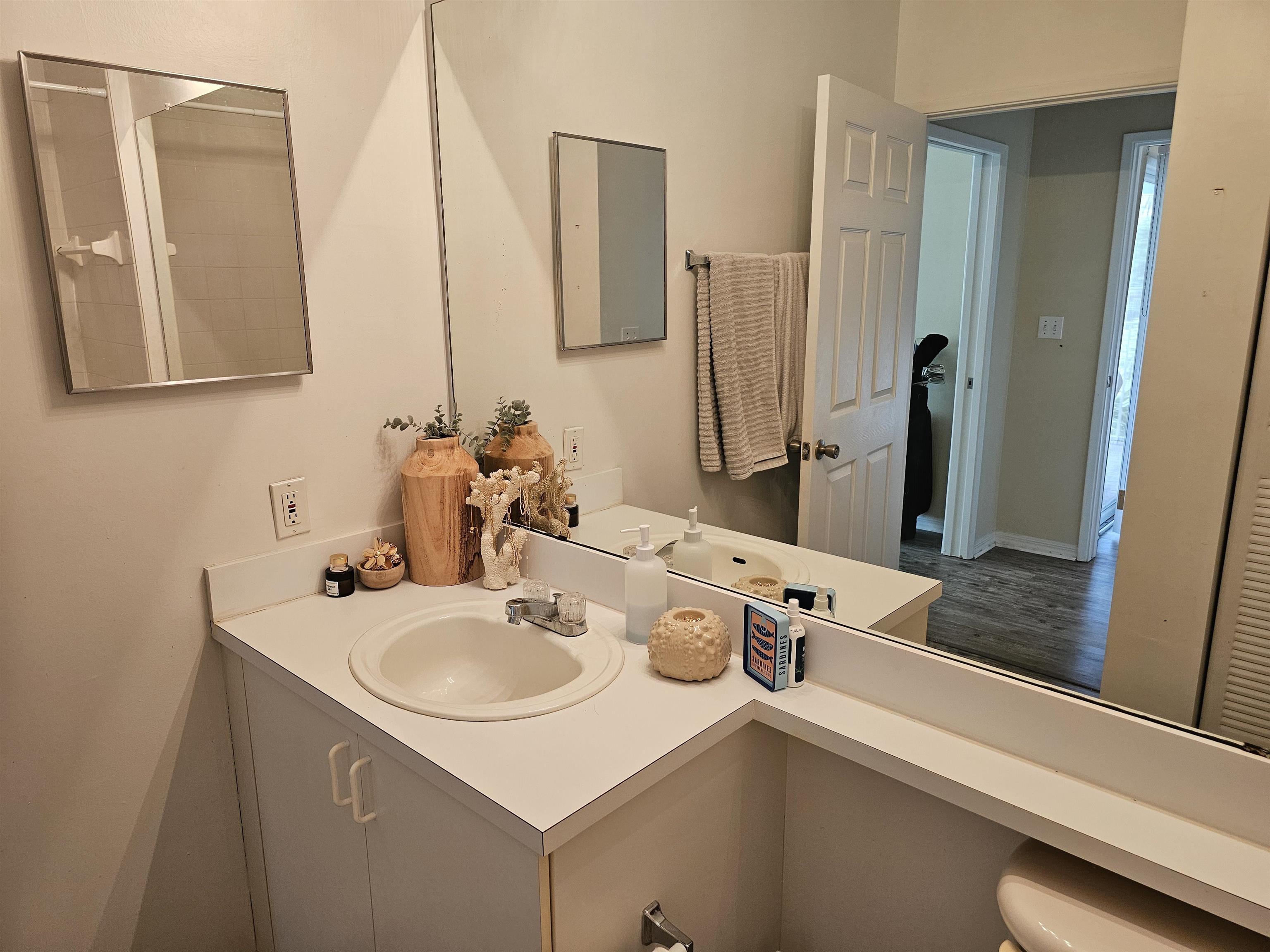 605 Fairway Drive, Unit 307 St. Augustine, FL 32084 - Photo 9 of 16 a bathroom with a sink and a mirror