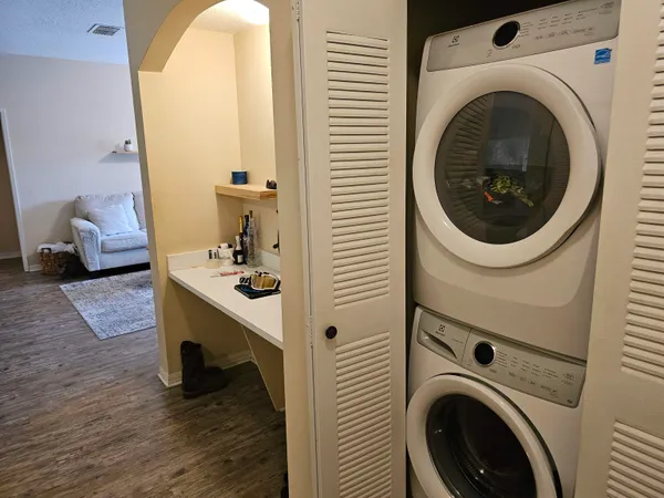 a view of a hallway with washer and dryer