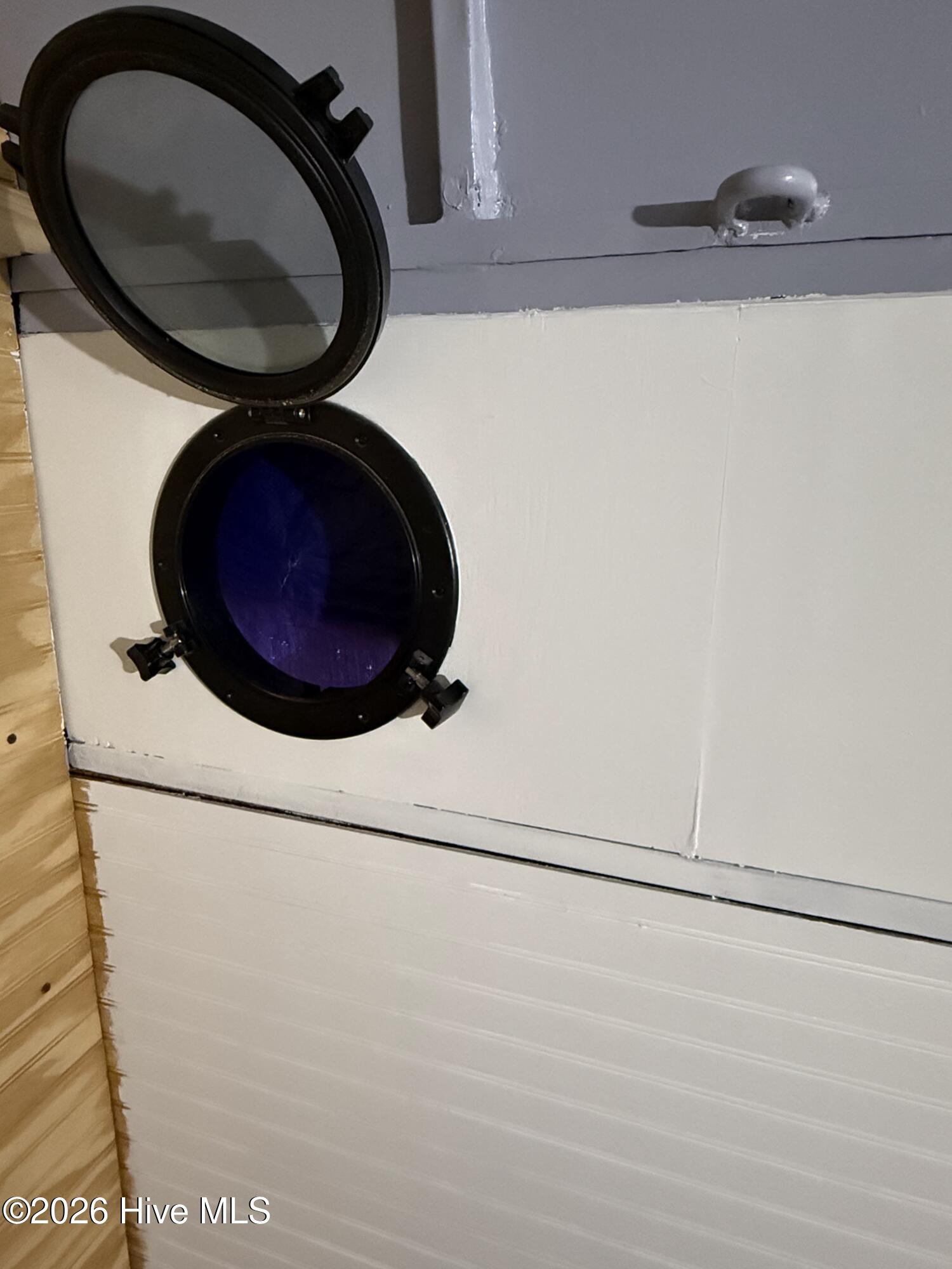 801 Jeff Road Minnesott Beach, NC 28510 - Photo 16 of 16 INSIDE TRAILER PORTHOLE WINDOW