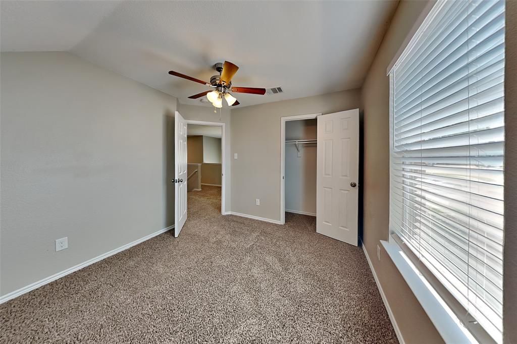 1202 Dove Brook Drive Allen, TX 75002 - Photo 15 of 23 Unfurnished bedroom featuring carpet flooring, a ceiling fan, a closet, and vaulted ceiling