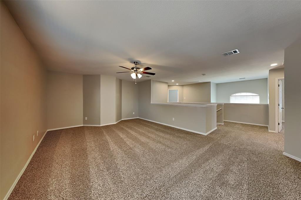 1202 Dove Brook Drive Allen, TX 75002 - Photo 21 of 23 Unfurnished room with light colored carpet, recessed lighting, and a ceiling fan