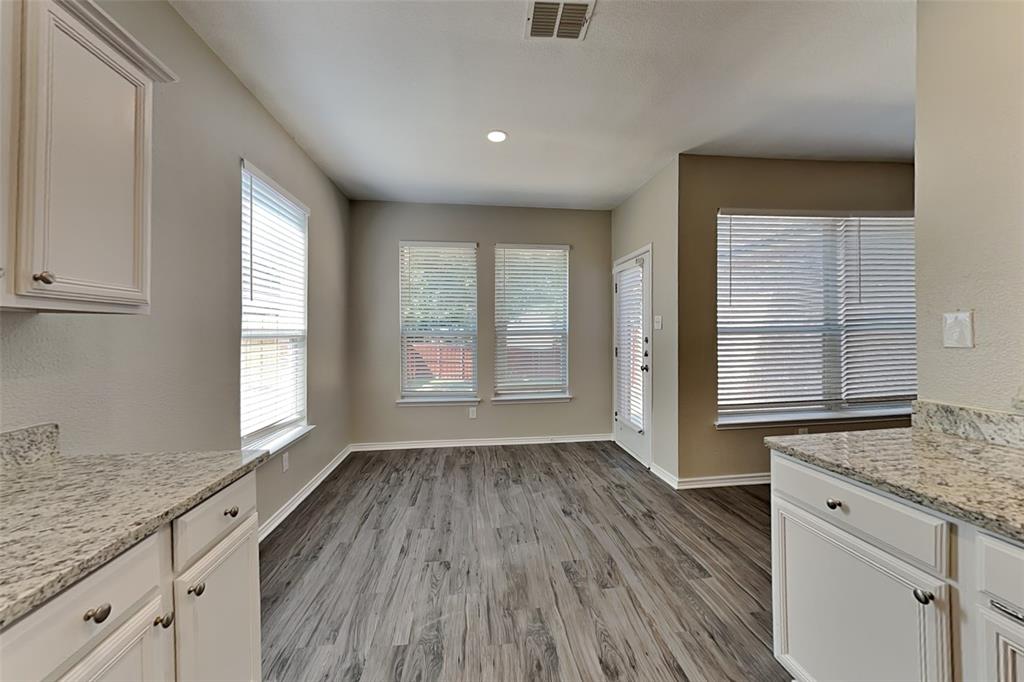 1202 Dove Brook Drive Allen, TX 75002 - Photo 5 of 23 Unfurnished dining area featuring light wood-type flooring and recessed lighting