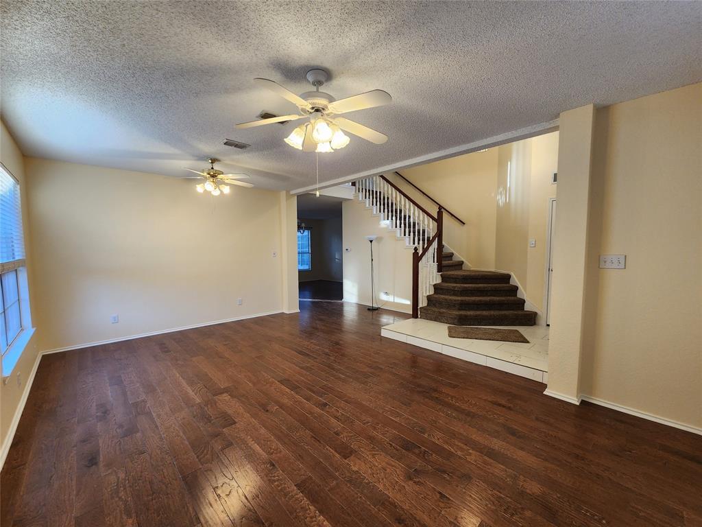 2413 Timber Ridge Lane Flower Mound, TX 75028 - Photo 6 of 32 Hardwood-finish flooring extending throughout the main living area