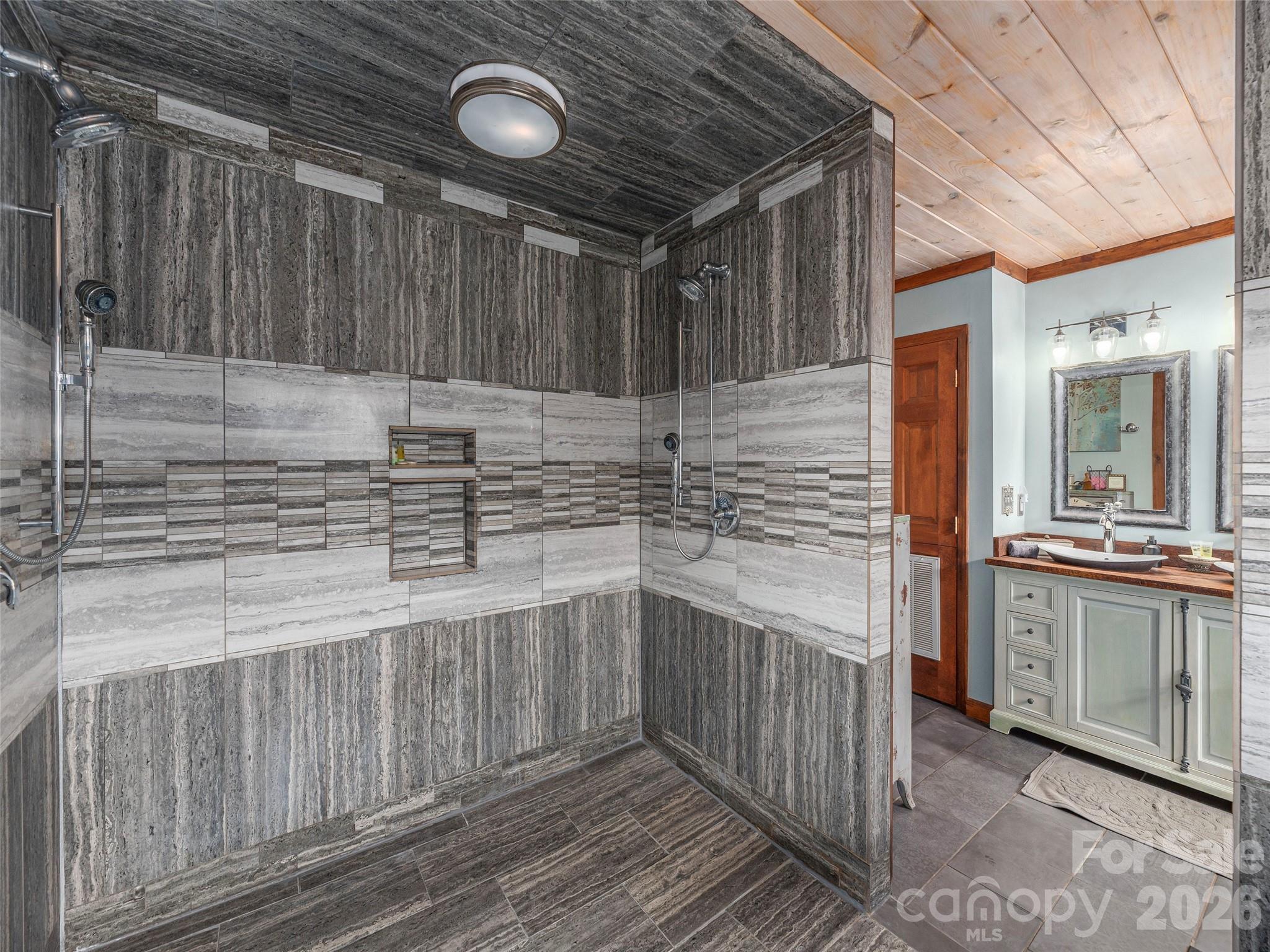 461 Ferguson Cove Loop Clyde, NC 28721 - Photo 25 of 46 a kitchen with stainless steel appliances wooden cabinets and a sink